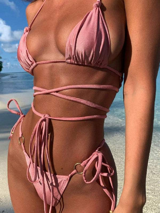 Sultry polyester knit dropped shoulder bikini set with strappy design, perfect for beachwear.