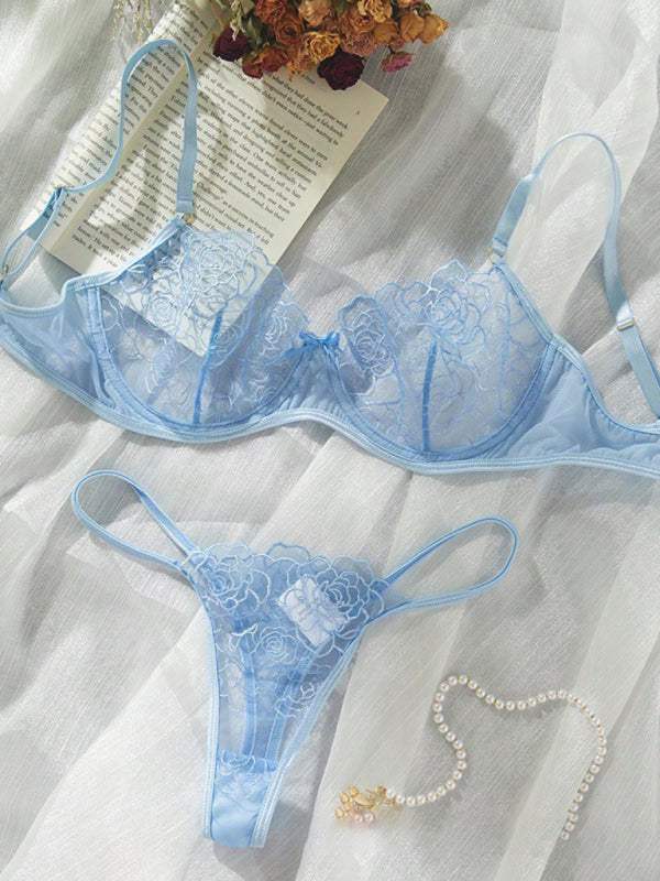 Sexy blue hollow bra and underwear set with floral lace design on light fabric.